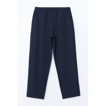 Pantaloni conici cu buzunare oblice