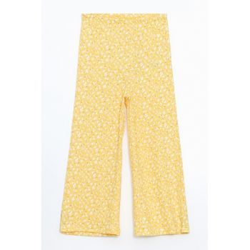 Pantaloni cu croiala ampla si talie elastica