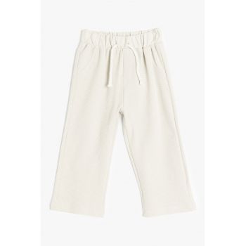 Pantaloni de trening cu croiala ampla si aspect texturat