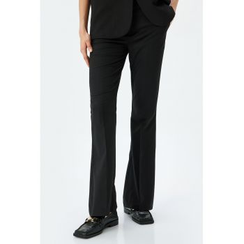 Pantaloni evazati cu buzunare laterale