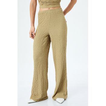 Pantaloni uni evazati