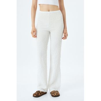 Pantaloni uni evazati