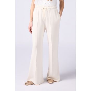 Pantaloni de trening cu croiala ampla si snur