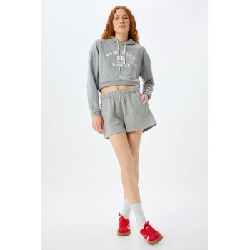 Pantaloni cu croiala ampla si buzunare laterale