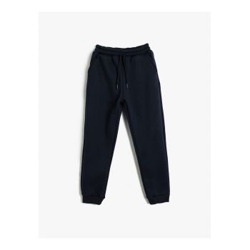 Pantaloni de trening uni cu buzunare oblice