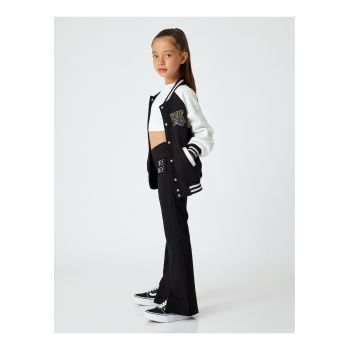 Pantaloni evazati cu slituri frontale