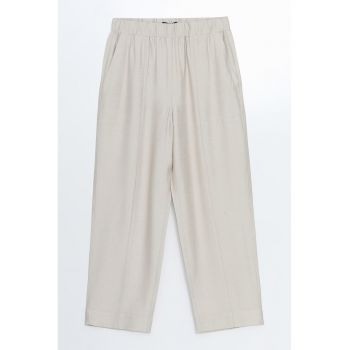 Pantaloni cu croiala conica si buzunare oblice