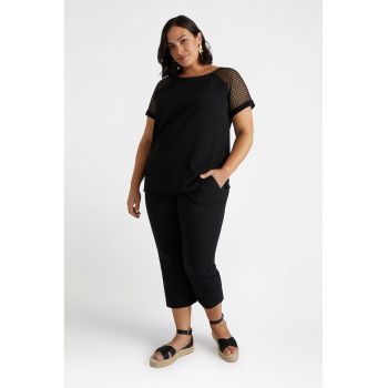 Pantaloni capri cu buzunare oblice