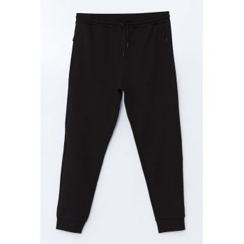 Pantaloni de trening din amestec de bumbac cu croiala conica