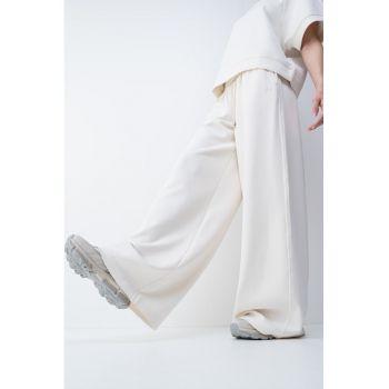 Pantaloni de trening din amestec de lyocell cu croiala ampla