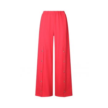 Pantaloni cu croiala ampla si buzunare cu capse