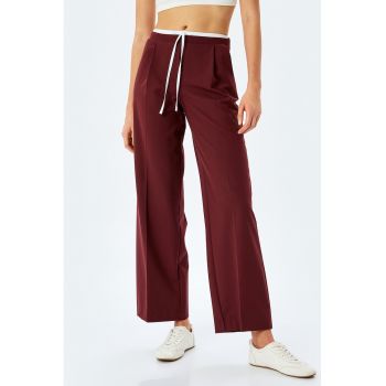 Pantaloni cu croiala ampla si talie inalta