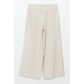 Pantaloni cu croiala ampla si talie elastica