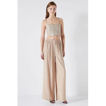 Pantaloni cu croiala ampla si talie elastica