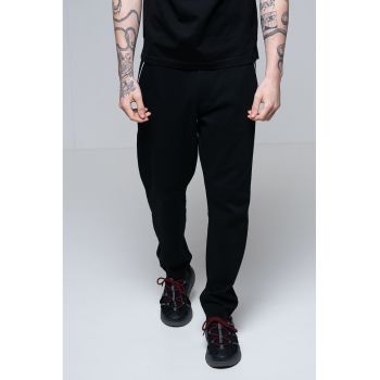 Pantaloni de trening cu croiala conica