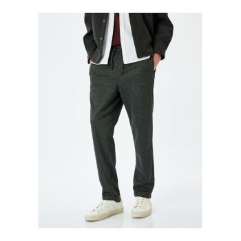 Pantaloni cu snur de ajustare si buzunare laterale
