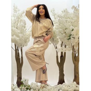 Pantaloni aurii cu floare evazati