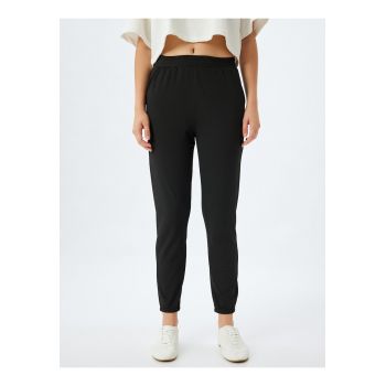 Pantaloni crop conici