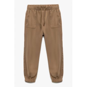 Pantaloni conici cu talie elastica si mansete